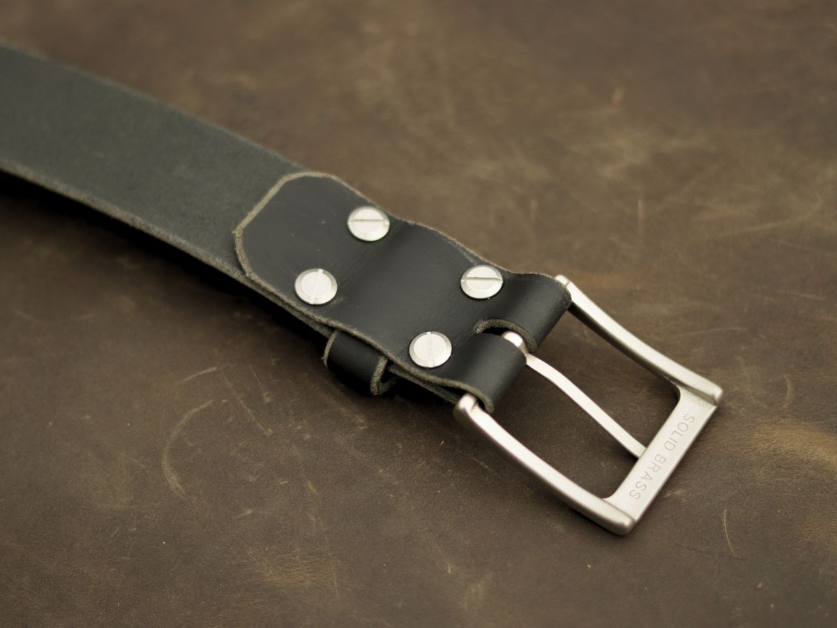 Black Water Buffalo mens dress belt showing solid brass hardware and hand-punched holes — won't curl fold or sag, handcrafted in Northern Alberta - Stewart Leather