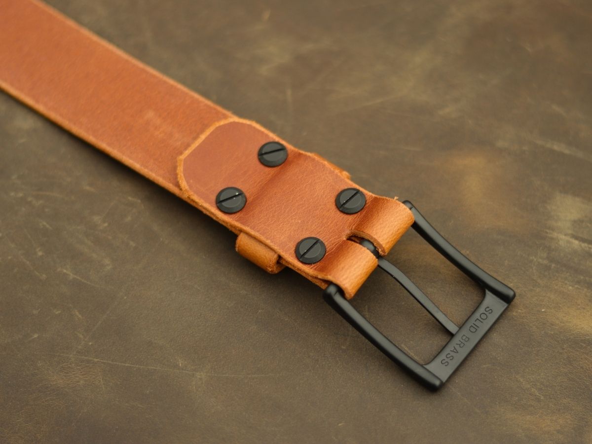 Cognac Water Buffalo mens dress belt showing solid brass hardware and hand-punched holes — won't curl fold or sag, handcrafted in Northern Alberta - Stewart Leather