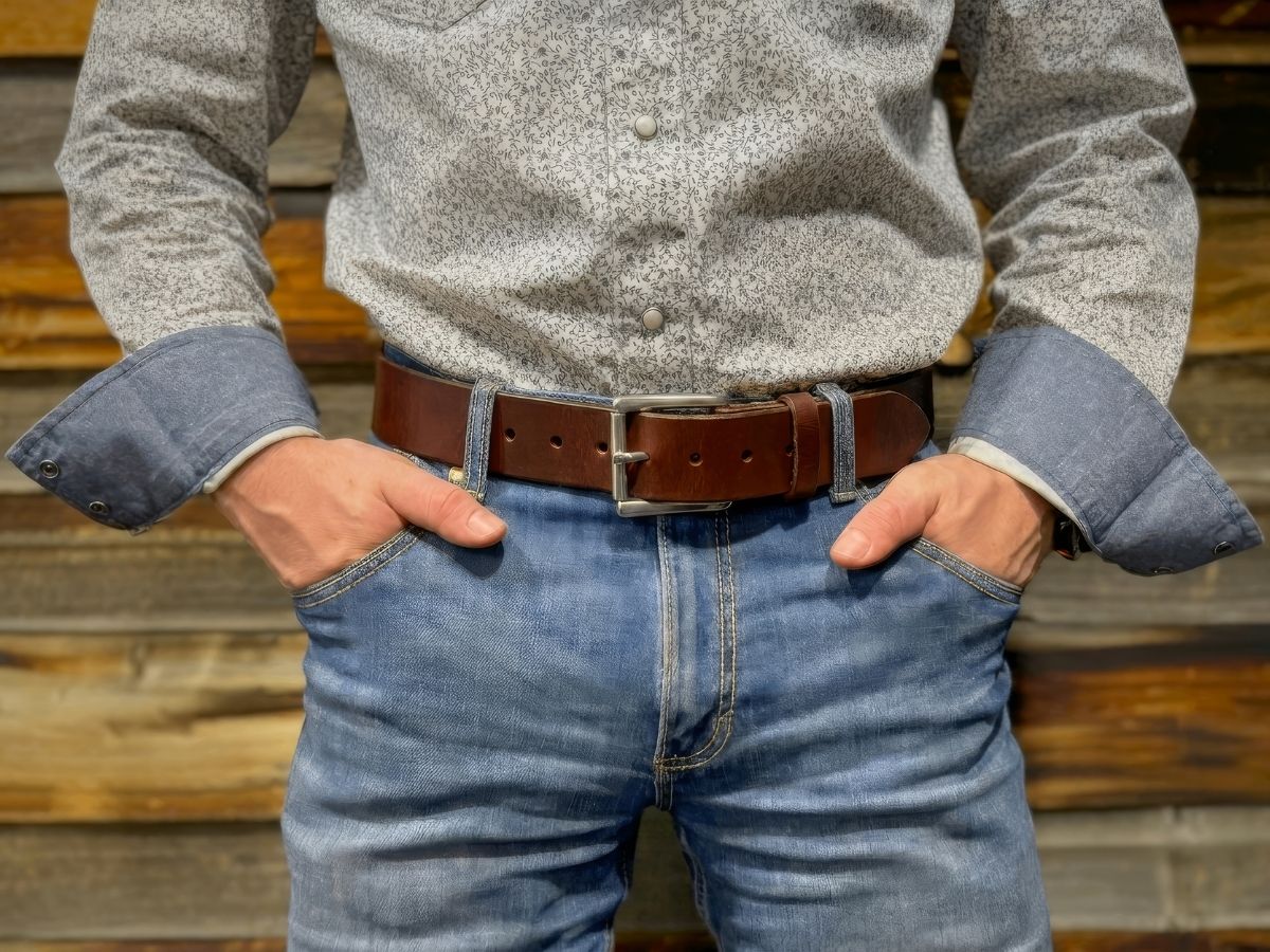 Rich brown leather work belt worn on the job — The Man Belt 1¾ inch full-grain English bridle hide, won't twist or fold, handcrafted in Northern Alberta - Stewart Leather