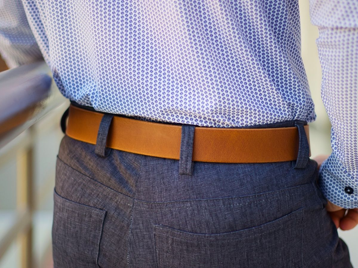 Side view of cognac Water Buffalo leather mens dress belt — 1.5 inch sharp clean fit for dress pants, buy once wear for life, made in Alberta - Stewart Leather
