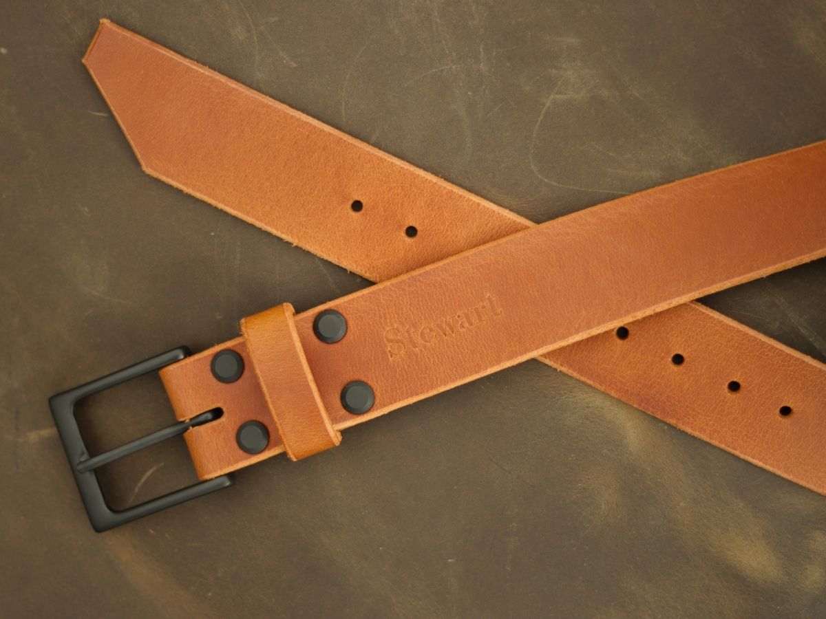 Cognac mens leather dress belt buckle detail — solid brass interchangeable buckle with 4 brass Chicago screws, full-grain Water Buffalo hide made in Alberta - Stewart Leather