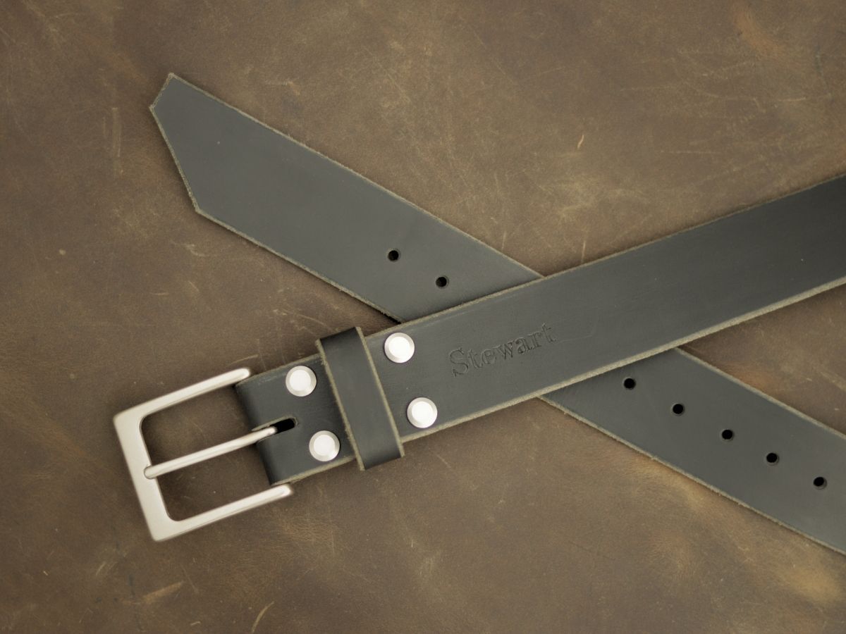 Black mens leather dress belt buckle detail — solid brass interchangeable buckle with 4 brass Chicago screws, full-grain Water Buffalo hide made in Alberta - Stewart Leather