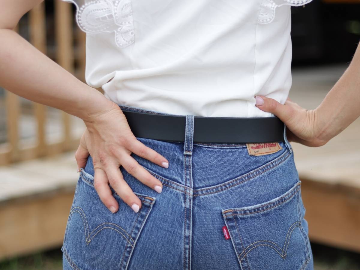 Woman wearing Her Belt Black with jeans, side view - Women's leather belt - full grain water buffalo leather
