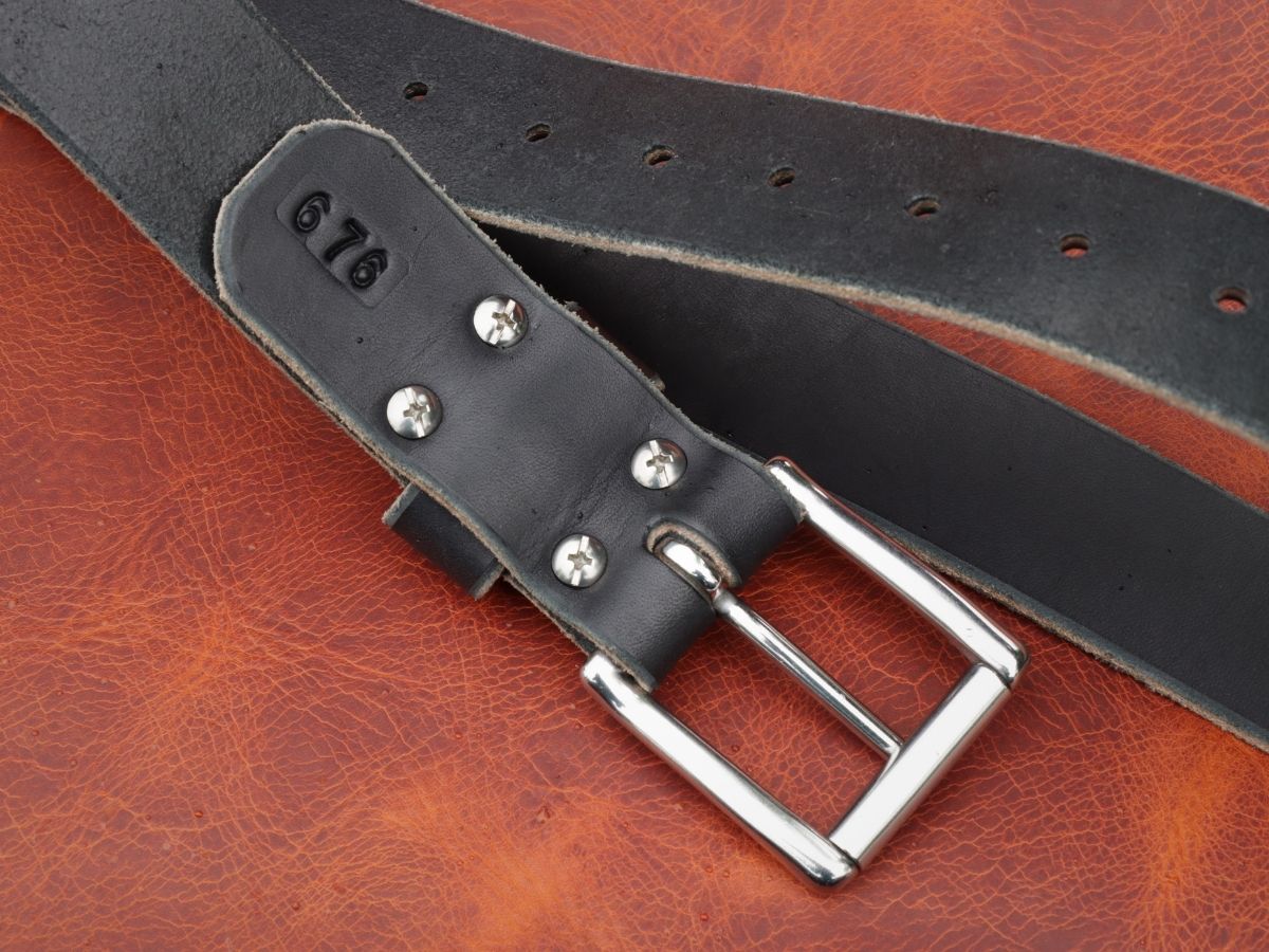 Black 1.5 inch leather work belt showing beeswax burnished edges and stainless hardware — built for daily hard wear, handcrafted in Northern Alberta - Stewart Leather