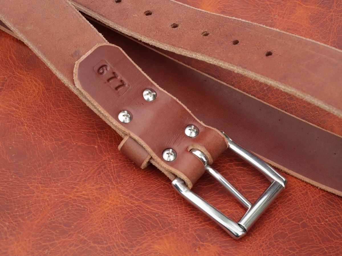 Rich brown 1.5 inch leather work belt showing beeswax burnished edges and stainless hardware — built for daily hard wear, handcrafted in Northern Alberta - Stewart Leather